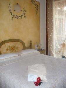 Postel nebo postele na pokoji v ubytování B&B I fiori di Marianna