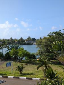 a view of a body of water with trees at Desirella Villa APARTMENT in Mahébourg