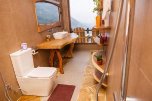 a bathroom with a toilet and a sink at Velora Inn in Ella +30 photos