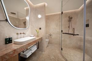 a bathroom with a sink and a shower at Hotel Indigo Xi'an High-tech Zone by IHG in Xi'an