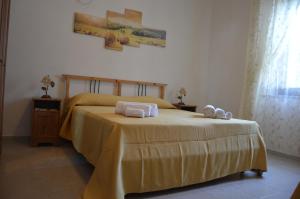 Ένα ή περισσότερα κρεβάτια σε δωμάτιο στο Azienda Agrituristica Caridà