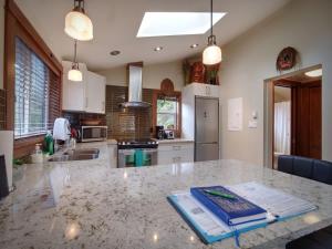 a kitchen with a marble counter top in a kitchen at Tiltin Hilton- Ocean View - Pet Friendly - sleep 4 in Port Renfrew +12 photos