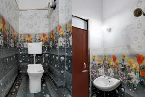 a bathroom with a toilet and a sink at OYO Hotel O Subedarganj Railway Junction Formerly Krishna Inn in Prayagraj
