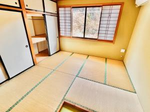 an empty room with a window and a floor at 神庭-kaniwa- in Chichibu