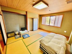 a bedroom with a bed and a desk and a window at 神庭-kaniwa- in Chichibu +46 photos