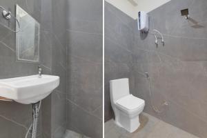 a bathroom with a white toilet and a sink at Hotel O Deva Road Lucknow Formerly Awadh Regency in Lucknow