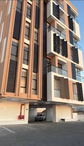 a building with a car parked in front of it at Alaziba view in ‘Udhaybah