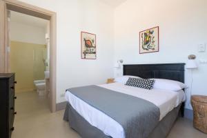 מיטה או מיטות בחדר ב-Villa Rosalore' by BarbarHouse