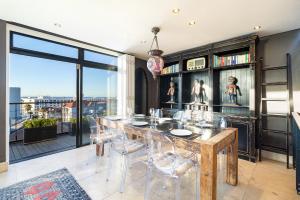 a dining room with a table and chairs at Namaste in Cape Town +19 photos