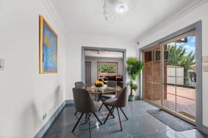a dining room with a table and chairs at The Laneway - 3BR, Pet Friendly, Walk to CBD in Port Lincoln