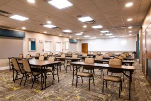 a classroom with tables and chairs in a room at Hampton Inn & Suites College Station in College Station
