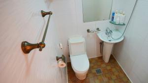 a bathroom with a toilet and a sink at Hanok Onew in Jeonju +68 photos