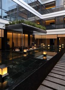 an external view of a building with lights at CHUN LIN BOUTIQUE HOTEL in Dali
