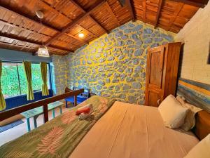 a bedroom with a bed in a room at Captans Stay in Lonavala +193 photos