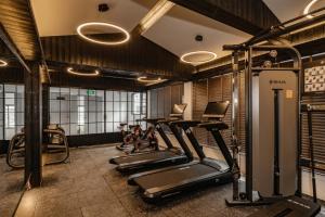 a gym with several exercise bikes in a room at CHUN LIN BOUTIQUE HOTEL in Dali