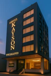 a hotel with a sign on the side of a building at Kaysons hotel in Hyderabad