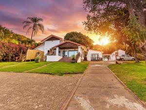 a house with a driveway in front of it at Picasso - Zur See in Ballito