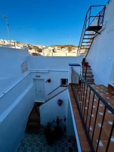 a view of a stairway with stairs and a stair case at CasaElbarranko in Arcos de la Frontera