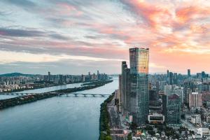 a view of a city with a river and buildings at Grand Hyatt Changsha in Changsha