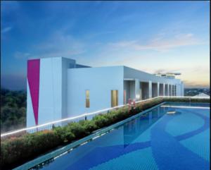 a swimming pool on the roof of a building at favehotel Madiun in Madiun +16 photos