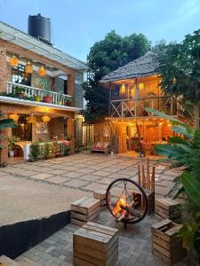 a patio with a fire pit in front of a building at Serengeti Home in Arusha