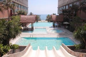 a swimming pool in the middle of a building at Mandala Sands Mũi Né in Phan Thiet
