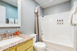 a bathroom with a sink and a toilet at Sea Treasures Inn #210 in Rockaway Beach +13 photos