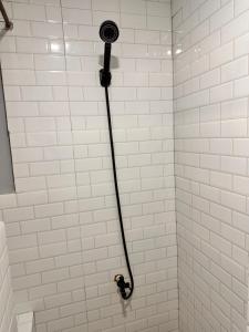 a shower with a shower head in a bathroom at Capitol Tourist Inn 2026 in Cebu City