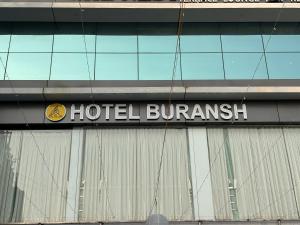 a hotel durham sign on the side of a building at Hotel Buransh in Haldwāni