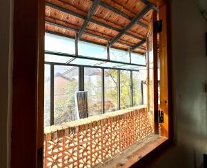 an open window of a house with a view of the outside at Homestay Xóm Rớ in Ðông Tác (1)