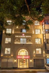 a building with a sign on the front of it at The Delhi Dreams - A Luxury Hotel in New Delhi
