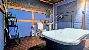 a bathroom with a white sink and a toilet at Bavarian Maun Apartments in Maun +14 photos
