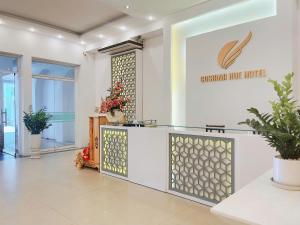 a lobby of a blue ridge hotel with a reception desk at Cosiana Hue Hotel in Hue +78 photos