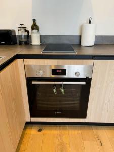 a oven in a kitchen with a counter at Albatross Relax seaside in Ķesterciems