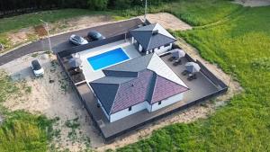 an aerial view of a house with a swimming pool at Luxury Villa JAKOV in Banja Luka