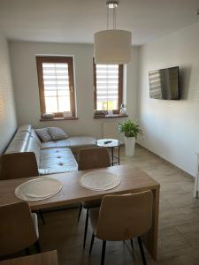 a living room with a couch and a table at Apartamenty AP 8 in Częstochowa