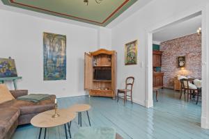 a living room with a couch and a table at BELETAGE in Emden