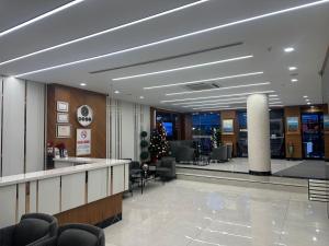 an office lobby with a christmas tree in the middle at İstanbul Trend Hotel Old City in Istanbul