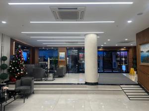 a lobby with a christmas tree in the middle at İstanbul Trend Hotel Old City in Istanbul