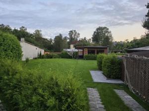 a view of a yard with a house at Tīkli 3 in Bigauņciems