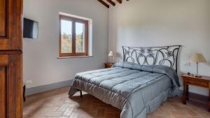 a bedroom with a bed and a window at Casa Andrea 12 in Orvieto +42 photos