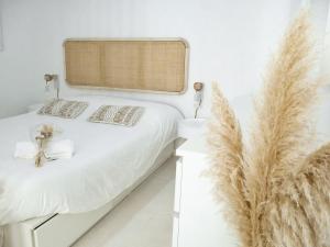 a bedroom with a bed with feathers on it at Alcácer do Sal Hideaway in Alcácer do Sal