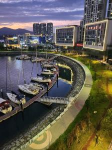 a group of boats docked in a marina in a city at 히얼마리나 in Ungch'ŏn-ni