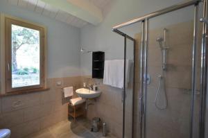 a bathroom with a sink and a shower at Villa Cielo- Cignella Resort Tuscany Accommodation in Osteria Delle Noci +20 photos