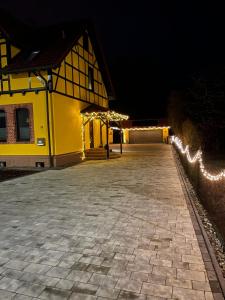 a building with lights on the side of it at Neurenovierte FeWo Harztor in Nordhausen