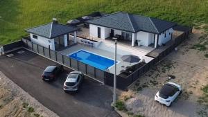 an aerial view of a house with a swimming pool at Luxury Villa JAKOV in Banja Luka