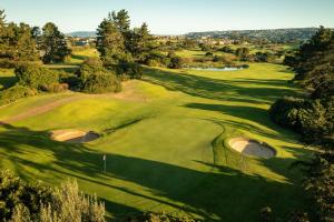 an overhead view of a golf course with two holes at 173 at The Dunes in Keurboomstrand