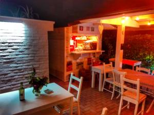 a restaurant with tables and chairs and a refrigerator at Hotel Villa Cesare B&B in Alba Adriatica +32 photos