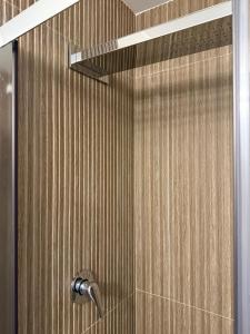 a shower with a shower head in a bathroom at B&B Il Colore del mare in Agropoli