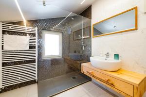 a bathroom with a sink and a mirror at Torretta In Centro Perugia in Perugia +39 photos